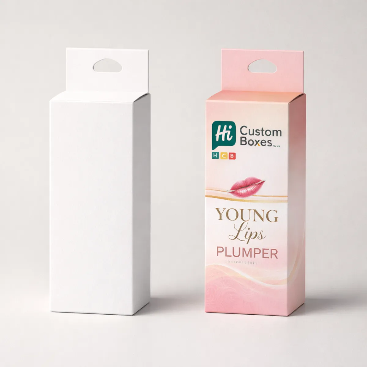 Two vertical retail boxes with hang tags, featuring a blank white version and a branded pink version. class=